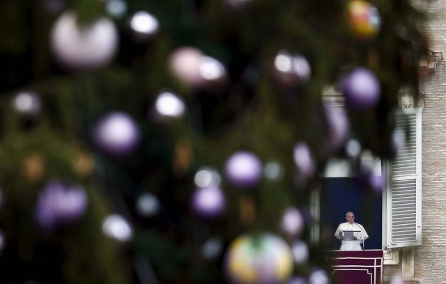 Pope Francis leads his Angelus prayer in Saint Peter's Square at the Vatican, December 8, 2015. REUTERS/Tony Gentile