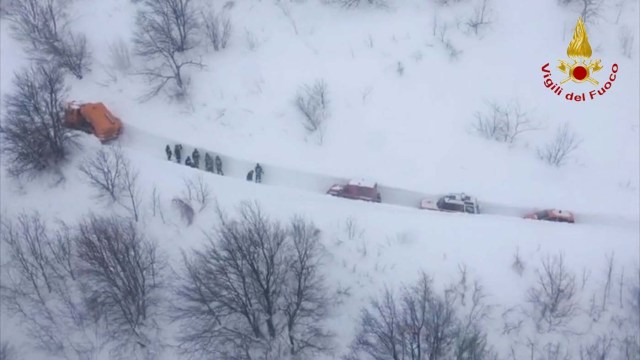 An aerial photo shows the rescuers heading to Hotel Rigopiano in Farindola, central Italy, hit by an avalanche, in this January 19, 2017 handout picture provided by Italy's Firefighters. Vigili del Fuoco/Handout via REUTERS ATTENTION EDITORS - THIS IMAGE WAS PROVIDED BY A THIRD PARTY. EDITORIAL USE ONLY.