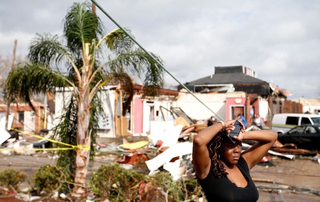 NEW ORLEANS, LA - FEBRUARY 07: A woman looks at the wreckage caused by a tornado which touched down along Chef Menture Avenue on February 7, 2017 in New Orleans, Louisiana. According to the weather service 25 people were injured in the aftermath of the tornado. Sean Gardner/Getty Images/AFP