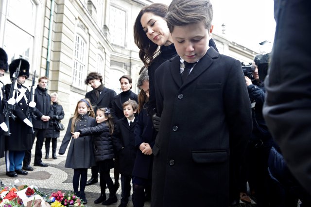 Denmark's Crown Princess Mary and Prince Christian look at flowers in front of Amalienborg Palace in Copenhagen, Denmark, February 15, 2018. Ritzau Scanpix Denmark/Mads Claus Rasmussen via REUTERS ATTENTION EDITORS - THIS IMAGE WAS PROVIDED BY A THIRD PARTY. DENMARK OUT. NO COMMERCIAL OR EDITORIAL SALES IN DENMARK.