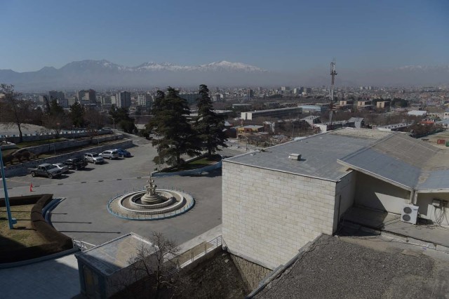 This photograph taken on March 7, 2018 shows a general view of the parking area of the Intercontinental Hotel in Kabul. Richard Clayderman's sweet-sounding "Romeo and Juliet" piano music accompanied Taliban gunmen as they rode in gold mirrored elevators to the upper floors of a Kabul luxury hotel in January in search of foreign guests to kill. At least 25 people, including 15 foreigners, were killed. Nearly seven weeks on, AFP was allowed to inspect the still badly damaged hilltop hotel overlooking the Afghan capital as it partially reopened its doors to the reluctant public. / AFP PHOTO / SHAH MARAI / TO GO WITH 'AFGHANISTAN-UNREST-HOTEL' SCENE by ALLISON JACKSON and EMAL HAIDARY