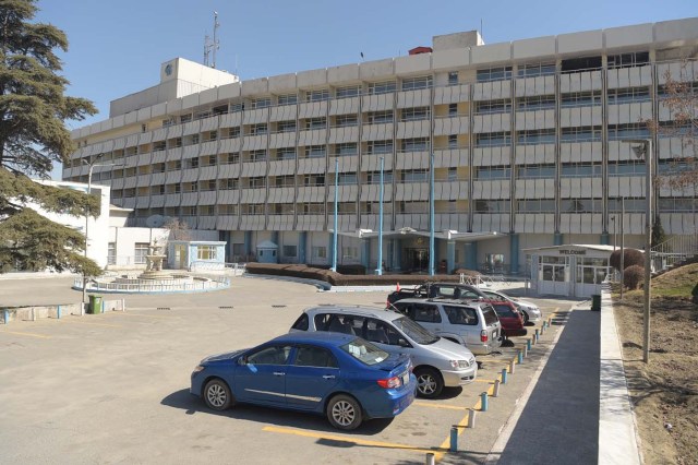 This photograph taken on March 7, 2018 shows a general view of one of the facade and parking areas of the Intercontinental Hotel in Kabul. Richard Clayderman's sweet-sounding "Romeo and Juliet" piano music accompanied Taliban gunmen as they rode in gold mirrored elevators to the upper floors of a Kabul luxury hotel in January in search of foreign guests to kill. At least 25 people, including 15 foreigners, were killed. Nearly seven weeks on, AFP was allowed to inspect the still badly damaged hilltop hotel overlooking the Afghan capital as it partially reopened its doors to the reluctant public. / AFP PHOTO / SHAH MARAI / TO GO WITH 'AFGHANISTAN-UNREST-HOTEL' SCENE by ALLISON JACKSON and EMAL HAIDARY