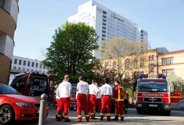 Firefighters take positions next to the Charite hospital before the evacuation while a World War Two bomb is defused near the central train station in Berlin, Germany, April 20, 2018. REUTERS/Axel Schmidt