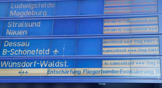 A sign with information about evacuation of the central train station is pictured while a World War Two bomb is defused in Berlin, Germany, April 20, 2018. REUTERS/Axel Schmidt